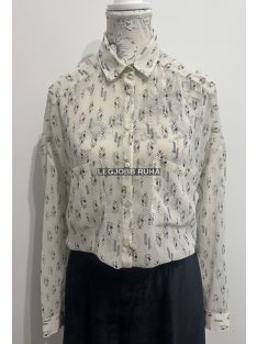   Hosszú ujjú elegáns szabású, ingblúz, anyagában absztrakt mintázattal, a mellénél zsebekkel.