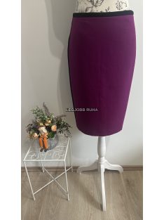   Térdig érő ceruzaszoknya, mely elegáns irodai stílust képvisel. 